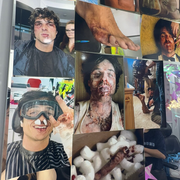 A photograph of photographs stuck against a wall of Jacob Elordi's face as Nate in Euphoria S3.